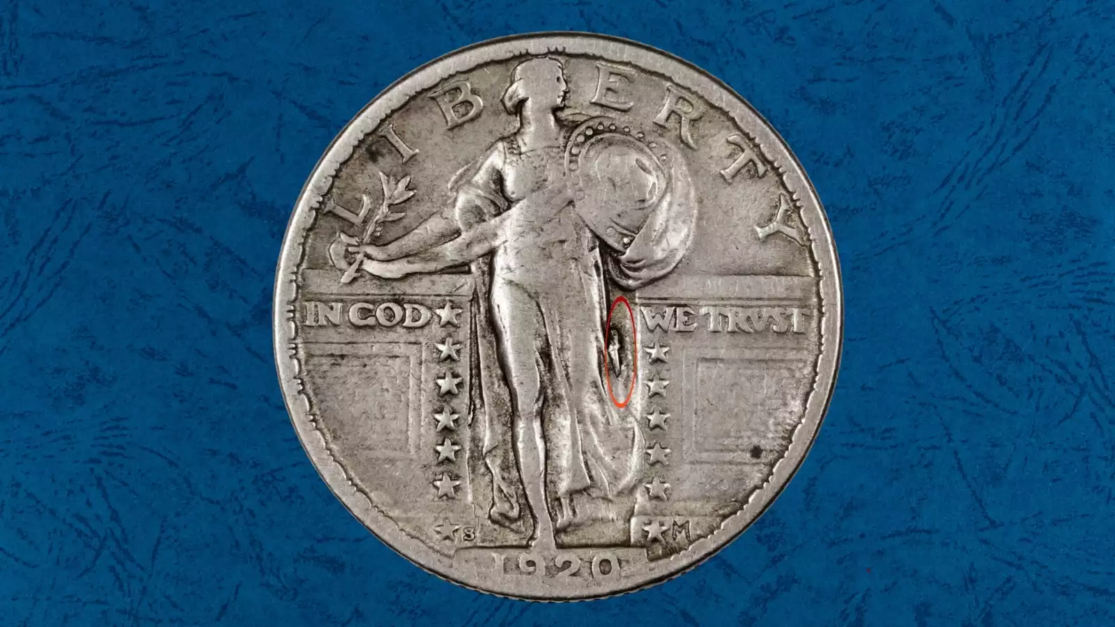 1920-S Standing Liberty Quarter Tear Drop die cud error showing teardrop shape near Liberty's gown